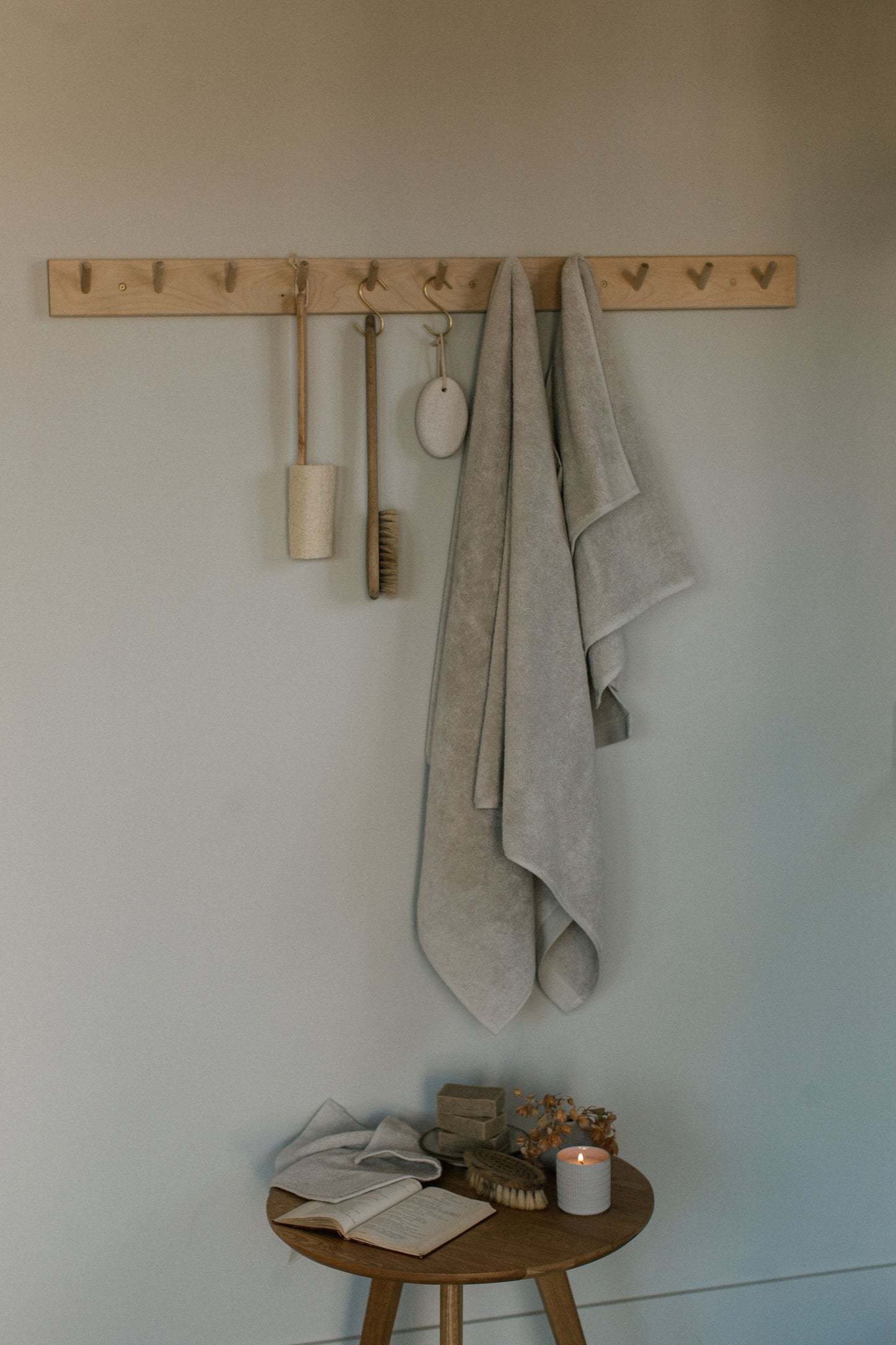 beige organic towel set hanging in pantry